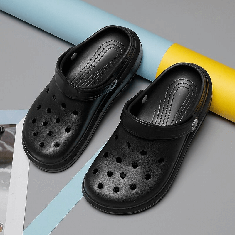 Stylish flexible lightweight black unisex crocs with durable EVA, 0-3cm platform, open side vamp, and solid pattern for casual comfort.